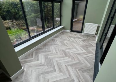 Polyfloor Camaro LVT flooring range fitted in the herringbone design to the ground floor - Toddington LU5
