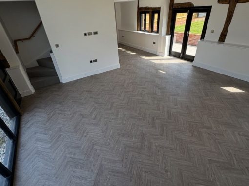 Polyfloor Camaro Naked Blond Oak LVT flooring in a classic herringbone design – Project 30