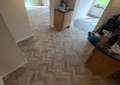 Colonia LVT flooring in Oak Plank, Bloomfield Oak Herringbone and Balmoral Grey Slate designs fitted - Flitwick MK45